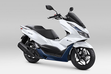 Honda PCX scooter in white and blue, side view