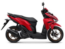 Honda Vario 160 scooter in red and black, side view